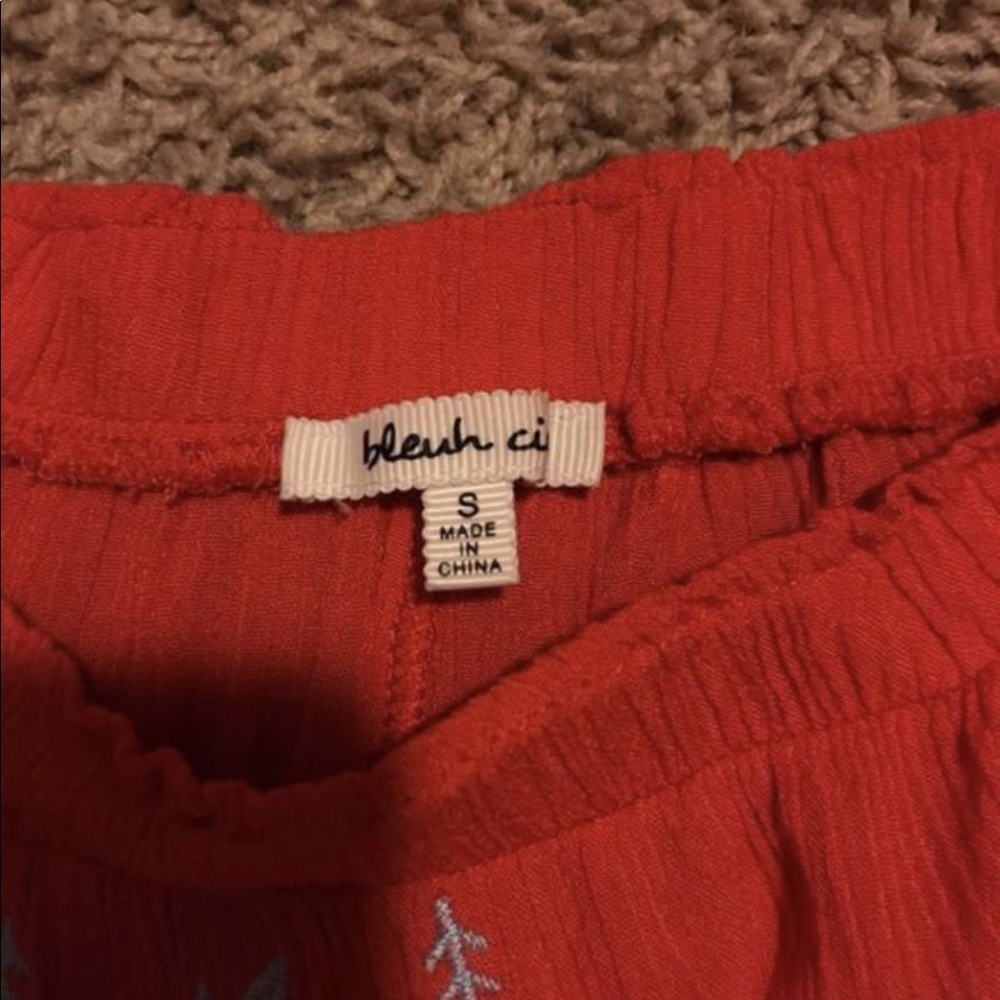Off the shoulder red shirt